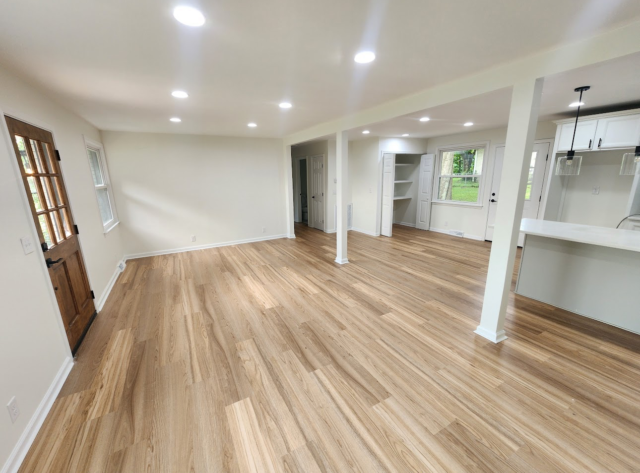 Bright, finished living room with hardwood flooring
